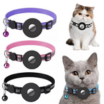 A happy dog wearing a black reflective nylon collar with an Apple AirTag securely fitted inside the integrated waterproof slot